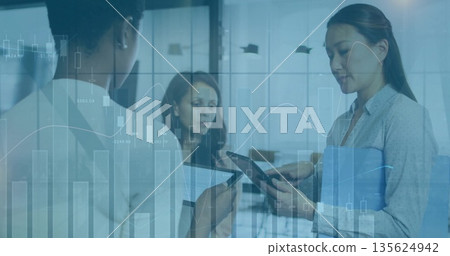 Three colleagues in blazers analyzing graphs in office, with tablet smartphone and folder Three colleagues in blazers analyzing graphs in office, with tablet smartphone and folder 135624942