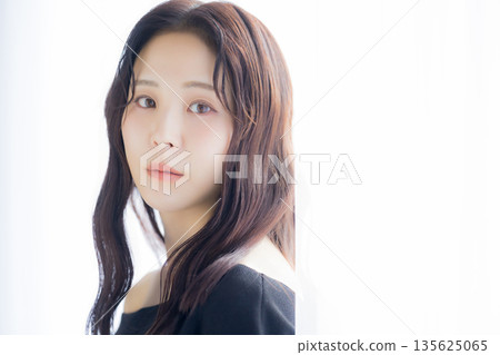 A woman basking in the morning sun 135625065