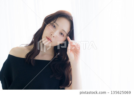 A woman basking in the morning sun 135625069