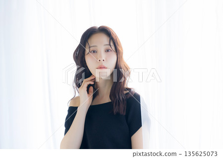 A woman basking in the morning sun 135625073