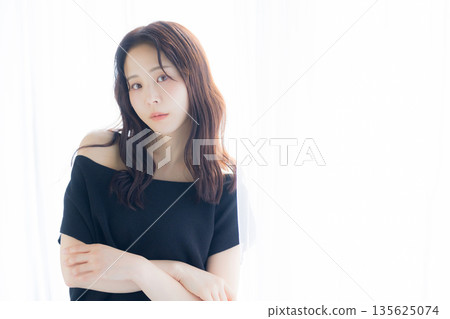 A woman basking in the morning sun 135625074