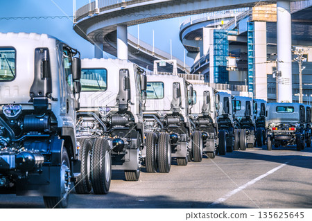Yokohama cityscape in Japan Japanese economy...a row of trucks Yokohama cityscape in Japan Japanese economy...a row of trucks 135625645