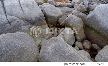 Rugged Pile of Large Granite Stones at Siangau Beach Natural Landscape 135625799