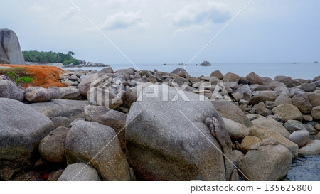 Scenic Tropical Beach Landscape with Giant Rocks and Red Soil Cliffs Scenic Tropical Beach Landscape with Giant Rocks and Red Soil Cliffs 135625800
