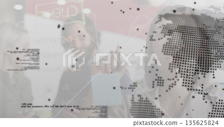 Pointing male working on glass wall in bright tech office, using marker and dot-map overlay 135625824