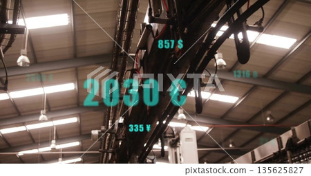 Overhead conveyors and robotic arms operating in plant, with beams, ducts, lights and teal currency Overhead conveyors and robotic arms operating in plant, with beams, ducts, lights and teal currency 135625827