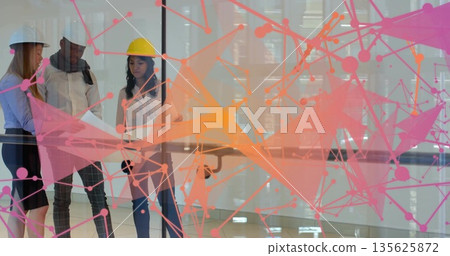 Three colleagues with hardhats reviewing plans in glass office, with digital overlay, copy space 135625872