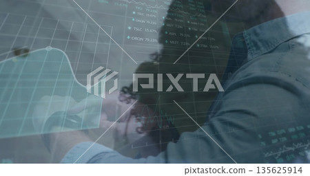 Displaying digital financial interface in office, with grid lines, market tickers, collared shirts Displaying digital financial interface in office, with grid lines, market tickers, collared shirts 135625914