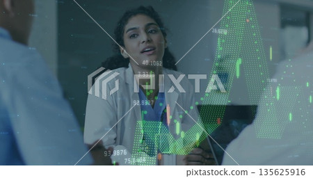 Leading doctor in lab coat briefing medical team at conference table projecting financial charts Leading doctor in lab coat briefing medical team at conference table projecting financial charts 135625916