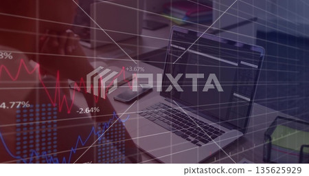Analyst sitting at office desk, resting head in hands with laptop smartphone and chart overlay Analyst sitting at office desk, resting head in hands with laptop smartphone and chart overlay 135625929