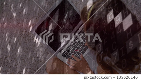 Typing child sitting on light gray shag rug, with glowing laptop keyboard, code overlay, copy space Typing child sitting on light gray shag rug, with glowing laptop keyboard, code overlay, copy space 135626140