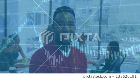 Smiling team leader presenting financial charts at conference table, with laptops and coffee cups Smiling team leader presenting financial charts at conference table, with laptops and coffee cups 135626191