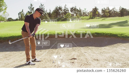 Holding club, golfer in golf attire preparing strike in sand bunker displaying social media overlay 135626260