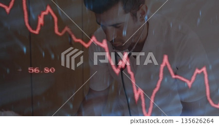 Leaning forward doctor examining red digital graph in clinic room with stethoscope and cabinets Leaning forward doctor examining red digital graph in clinic room with stethoscope and cabinets 135626264