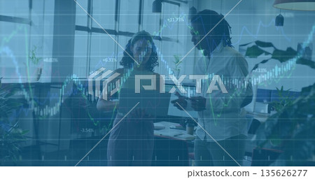 Analyzing stock charts professionals in casual shirts working in office, with laptop smartphone Analyzing stock charts professionals in casual shirts working in office, with laptop smartphone 135626277