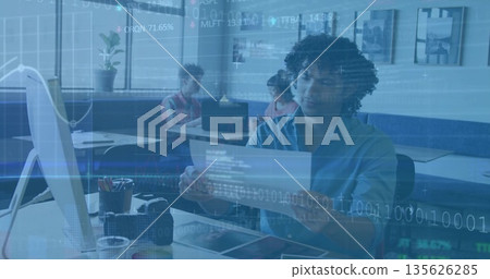 Professional reviewing printed document in modern coworking space, with monitor and data overlays Professional reviewing printed document in modern coworking space, with monitor and data overlays 135626285