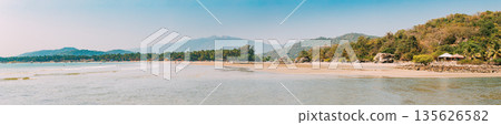 Canacona, Goa, India. Sunny Sky Over Calm Water Of Arabian Sea. Natural Landscape With Sandy Palolem Beach At Sunny Summer Day With Blue Sky Canacona, Goa, India. Sunny Sky Over Calm Water Of Arabian Sea. Natural Landscape With Sandy Palolem Beach At Sunny Summer Day With Blue Sky 135626582