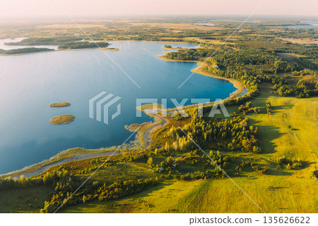 Braslaw Or Braslau, Vitebsk Voblast, Belarus. Aerial View Of Nedrava Lake, Green Forest And Meadow Landscape In Sunny Autumn Morning. Top View Of Beautiful European Nature From High Attitude. Bird's Braslaw Or Braslau, Vitebsk Voblast, Belarus. Aerial View Of Nedrava Lake, Green Forest And Meadow Landscape In Sunny Autumn Morning. Top View Of Beautiful European Nature From High Attitude. Bird's 135626622