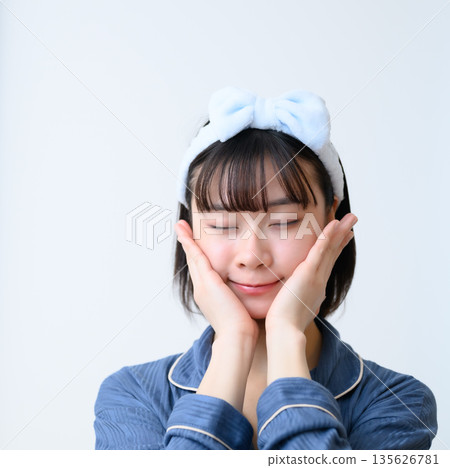 Smiling woman undergoing skin care Smiling woman undergoing skin care 135626781