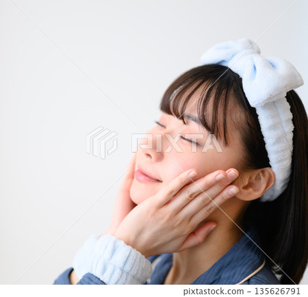 Woman's face during skin care 135626791