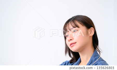 Woman relaxing in room wear Woman relaxing in room wear 135626803