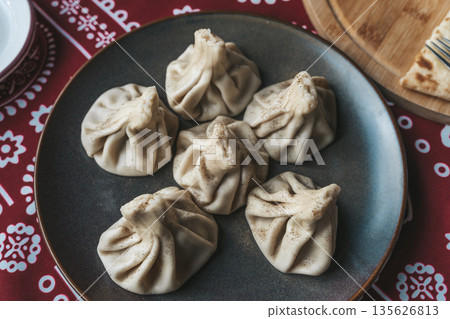 Traditional Georgian Khinkali Dumplings on a Plate Traditional Georgian Khinkali Dumplings on a Plate 135626813