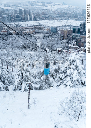 Tbilisi Aerial View with Blue Cable Car over Snowy Landscape Tbilisi Aerial View with Blue Cable Car over Snowy Landscape 135626818