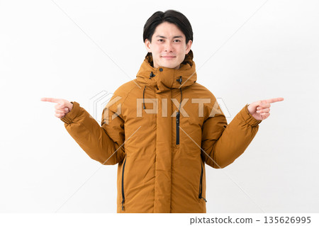 Young man wearing a down coat Young man wearing a down coat 135626995