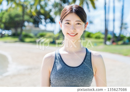 Young woman jogging at a resort 135627086