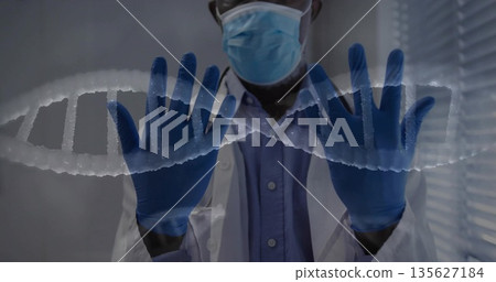 Examining doctor wearing mask gloves coat analyzing DNA helix projection in lab, with stethoscope Examining doctor wearing mask gloves coat analyzing DNA helix projection in lab, with stethoscope 135627184