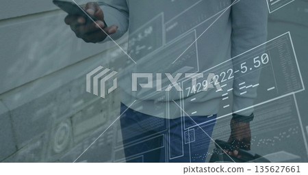 Businessman holding smartphone and briefcase by paneled wall, with digital panels and readouts Businessman holding smartphone and briefcase by paneled wall, with digital panels and readouts 135627661