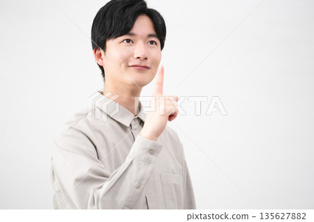 Young man wearing a long-sleeved shirt Lifestyle image Young man wearing a long-sleeved shirt Lifestyle image 135627882