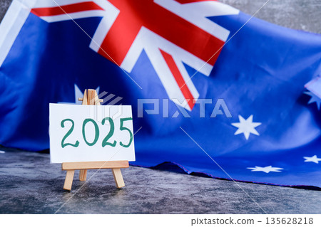 Australian flag and text 2025 trendy template for upcoming year campaigns. Patriotic design marking 2025 beside national flag. Concept of future vision and planning ideal for annual report or goal Australian flag and text 2025 trendy template for upcoming year campaigns. Patriotic design marking 2025 beside national flag. Concept of future vision and planning ideal for annual report or goal 135628218