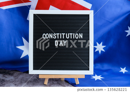 Patriotic Australian flag and signage Australia constitution day. Concept of civil rights and law legal awareness or civic holiday media Patriotic Australian flag and signage Australia constitution day. Concept of civil rights and law legal awareness or civic holiday media 135628221