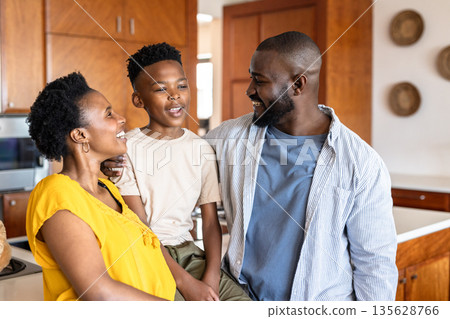 Happy family enjoying quality time together in modern kitchen at home 135628766