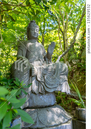 Amida Buddha statue at Mitaki-Dera temple in Hiroshima, Japan 135629532