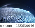 Close-up view of a fingerprint pattern illuminated by soft blue light on a dark background 135630046