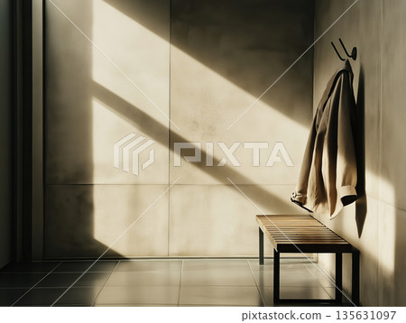 A half-empty cloakroom with a single coat left A half-empty cloakroom with a single coat left 135631097