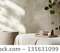 A minimalist spa room with an elegant massage table, a small tray with essential oils 135631099