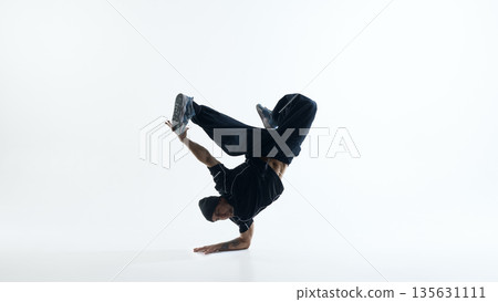 Breakdance power move freeze with extended legs isolated on white background 135631111
