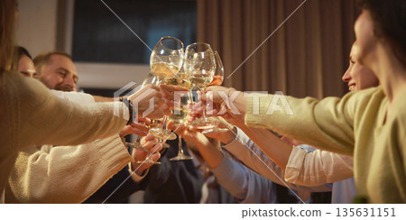 Close up of friends clinking wine glasses together. 135631151