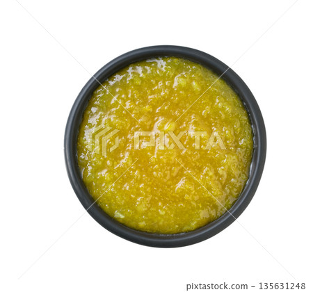 black bowl of lemon jam isolated on white background, top view. black bowl of lemon jam isolated on white background, top view. 135631248
