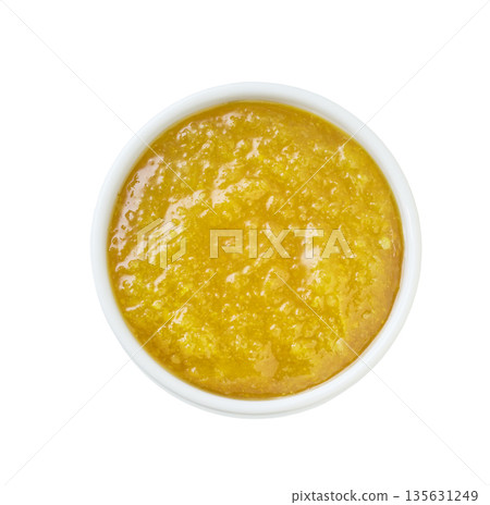Lemon jam in a white ceramic bowl isolated on white background, top view. Lemon jam in a white ceramic bowl isolated on white background, top view. 135631249