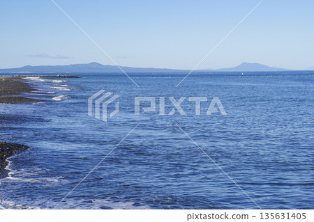 Kunashiri Island and the mountains of the Shiretoko Peninsula seen from Notsuke Peninsula 135631405