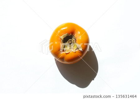 It is Persimmon lying on a white background It is Persimmon lying on a white background 135631464