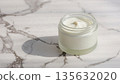 Face cream moisturiser, glass jar on marble stone background, skincare and cosmetic, beauty product concept 135632020