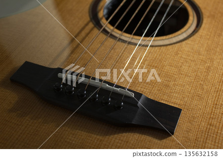 This is a close-up of the strings of an acoustic guitar. This is a close-up of the strings of an acoustic guitar. 135632158