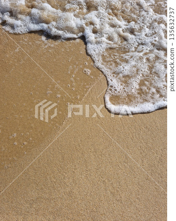 It is a sandy beach with waves rolling in. It is a sandy beach with waves rolling in. 135632737