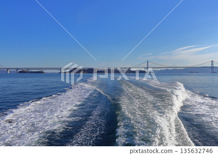 View of the Seto Ohashi Bridge and the islands directly below (Yoshima and Hasajima) from a boat View of the Seto Ohashi Bridge and the islands directly below (Yoshima and Hasajima) from a boat 135632746