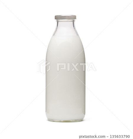 A glass bottle of milk is sitting on a white background A glass bottle of milk is sitting on a white background 135633790